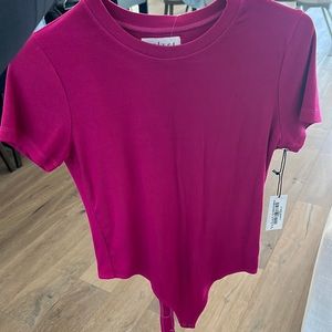 M Ribbed pink short sleeve body suit by velvet by Graham & spencer. Never worn